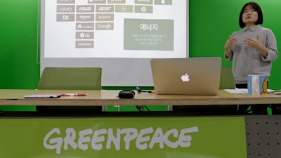 Insung Lee, program campaigner of Greenpeace, speaks during a press conference at Greenpeace office in Seoul, South Korea, Tuesday, Oct. 17, 2017. The environmental group issued a report on Tuesday giving technology titans like Samsung Electronics, Amazon and Huawei low marks for their environmental impact.