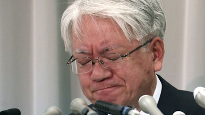 Kobe Steel President and CEO Hiroya Kawasaki reacts as he listens to a reporter's questions during a press conference in Tokyo, Thursday, Oct. 26, 2017. Kobe Steel says it has lost a Japan Industrial Standards certification for some of its copper products after reporting faked quality inspections for a slew of products used in cars, trains, aircraft and other equipment.