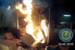 In this April 2014 file image frame grab from video, provided by the Federal Aviation Administration (FAA), a test at the FAAs technical center in Atlantic City, N.J. The U.S. government is urging that large, personal electronic devices like laptops be banned from airline checked luggage because of the potential for a catastrophic fire.