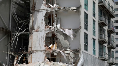 This Sept. 24, 2017 photo shows an apartment building that was partially destroyed during the 7.1 magnitude earthquake, on Emiliano Zapata Avenue in Mexico City. The eco-friendly apartment building with its wood-paneled balconies and a solar-paneled roof collapsed when a corner column failed, and the flat-slab structure pancaked, said Eduardo Miranda, a professor of civil and environmental engineering at Stanford and global expert on earthquake-resistant design.