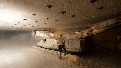 This undated photo provided by the U.S. Department of Energy show a continuous miner performing mining activities in the Waste Isolation Pilot Plant near Carlsbad, N.M. The U.S. Energy Department announced Tuesday, Oct. 17, 2017, that the work to carve out more disposal space from the ancient salt formation where the Waste Isolation Pilot Plant is located will begin later this fall. The work should be done in 2020.