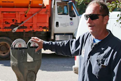 In this Wednesday, Oct. 11, 2017 photo, Wade Beal, parking meter technician, answers a question during an interview in Oklahoma City. The city where parking meters were born says it’s doing away with the last of its ancient, coin-operated models by the end of the year to make way for newer ones. Technology inside Oklahoma City’s old-school meters dated to the 1960s and 1970s, and many companies that once serviced them have long been out of business.