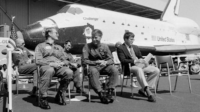 In this June 30, 1982, file photo, the new space shuttle Challenger sits behind the four astronauts that will fly it during turnover ceremonies at Rockwell International's final assembly site in Palmdale, Calif. From left: Dr. Story Musgrave, pilot Karol J. Bobko, mission specialist Donald H. Peterson and commander Paul J. Weitz. Weitz, a retired NASA astronaut who commanded the first flight of the space shuttle Challenger and flew on Skylab in the early 1970s, has died at 85. Weitz died at his retirement home in Flagstaff, Ariz., on Monday, Oct. 23, 2017, said Laura Cutchens of the Astronaut Scholarship Foundation.