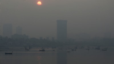 Morning smog envelops the skyline in Mumbai, India, Friday, Oct. 20, 2017. Environmental pollutants are killing at least 9 million people and costing the world $4.6 trillion a year, a toll exceeding that of wars, smoking, hunger or natural disasters. One out of every six premature deaths in the world in 2015, about 9 million, could be attributed to disease from toxic exposure.