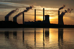 In this June 3, 2017, file photo, the coal-fired Plant Scherer, one of the nation's top carbon dioxide emitters, stands in the distance in Juliette, Ga. The Trump administration intends to roll back the centerpiece of former President Barack Obama’s efforts to slow global warming, seeking to ease restrictions on greenhouse gas emissions from coal-fired power plants.
