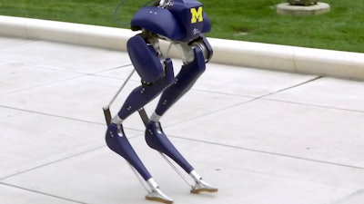 In this Monday, Oct. 23, 2017 image made from video, a new robot, named 'Cassie,' walks on the campus of the University of Michigan in Ann Arbor, Mich. Researchers say the two-legged, bird-like machine, which is capable of walking unassisted on rough and uneven terrain, could someday have applications for search-and-rescue efforts.