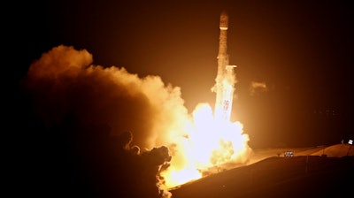 A SpaceX Falcon 9 rocket is launched from the Space Launch Complex-4 at Vandenberg Air Force Base, Calif., on Monday, Oct. 9, 2017. Ten new satellites for Iridium Communications Inc. have been carried into orbit by a SpaceX Falcon 9 rocket launched from California. The booster lifted off from coastal Vandenberg Air Force Base before dawn Monday and its first stage successfully returned from space and set down on a landing platform floating in the Pacific Ocean as the second stage went on to deploy the satellites in orbit.