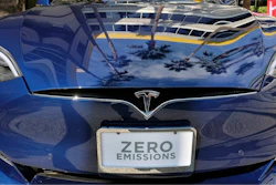 This Oct. 24, 2016, file photo shows Tesla Model S on display in downtown Los Angeles. Tesla Motors fired hundreds of workers after completing its annual performance reviews, even though the electric automaker is trying to ramp up production to meet the demand for its new Model 3 sedan. The Palo Alto, California-based company confirmed the cuts in a Saturday, Oct. 14, 2017 statement, but didn't disclose how many of its 33,000 workers were jettisoned.