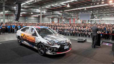 In this photo provided by Toyota Australia the last Toyota car produced in Australia is displayed for gathered workers in Melbourne, Tuesday, Oct. 3, 2017. Toyota closed its manufacturing plant in Melbourne, ending 54 years of production by the Japanese firm in Australia, the first country outside of Japan where the company made cars.