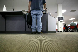 In this Friday, March 10, 2017, file photo, a lone job seeker checks in at the front desk of the Texas Workforce Solutions office in Dallas. On Thursday, Oct. 19, 2017, the Labor Department reports on the number of people who applied for unemployment benefits a week earlier.