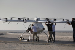 In this Sept. 26, 2017 photo, a Volocopter prototype is being pushed by their operators before it sets for a test fly in Dubai, United Arab Emirates, Tuesday, Sept. 26, 2017. Dubai is hoping to one day have flying, pilotless taxis darting among its skyscrapers. Just this week, the city-state in the United Arab Emirates hosted crews from the German company Volocopter, which had an electric, battery-powered two-seat prototype take off and land. Dubai hopes to have rules in place in the next five years to be ready for having the aircraft regularly flying through its skies.