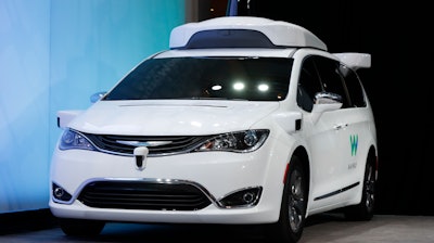 In this Sunday, Jan. 8, 2017, file photo, a Chrysler Pacifica hybrid outfitted with Waymo's suite of sensors and radar is shown at the North American International Auto Show in Detroit. Waymo, formerly Google’s self-driving car division and now part of Alphabet Inc., said Thursday, Oct. 26, 2017, it will start testing on public roads in suburban Detroit. The company uses Chrysler Pacifica minivans equipped with cameras, sensors and self-driving software. Backup drivers will be at the wheel for safety reasons.