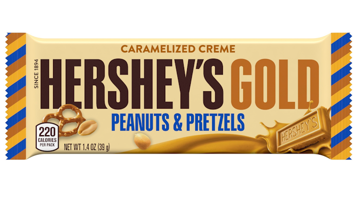 This image released by The Hershey Company shows their new candy bar Hershey's Gold that will go on sale Dec. 1, 2017. It’s described as a caramelized cream bar embedded with salty peanut and pretzel bits.