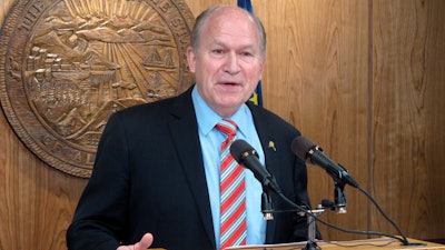 In this Tuesday, April 18, 2017, file photo, Alaska Gov. Bill Walker addresses reporters during a news conference in Juneau, Alaska. The state of Alaska will attempt to advance a multibillion dollar natural gas pipeline project with the help of interests from China. Walker said the agreement signed late Wednesday, Nov. 8, 2017, is with Sinopec, China Investment Corp. and the Bank of China.
