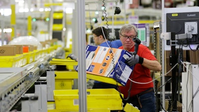 A worker at an amazon fulfillment center.