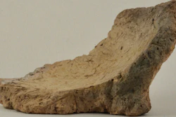This undated photo provided by the National Museum of Georgia in November 2017 shows a 3-inch (8-centimeter) shard of pottery vessels about 8,000 years old, found south of Tblisi, Georgia. Patrick McGovern of the Penn Museum in Philadelphia says the pieces had come from the base of jars that were probably used for fermentation and storage of wine.