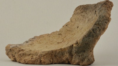 This undated photo provided by the National Museum of Georgia in November 2017 shows a 3-inch (8-centimeter) shard of pottery vessels about 8,000 years old, found south of Tblisi, Georgia. Patrick McGovern of the Penn Museum in Philadelphia says the pieces had come from the base of jars that were probably used for fermentation and storage of wine.