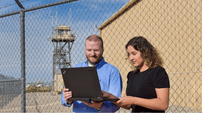 Sandia National Laboratories systems analysts Alex Dessanti and Karina Munoz-Ramos review the optimization criteria to select the best combination of equipment to create infrastructure for overseas Army bases.