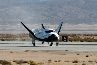 This Nov. 11, 2017 photo provided by Sierra Nevada Corporation shows the Dream Chaser spacecraft landing after a test flight at Edwards Air Force Base, Calif. The Sierra Nevada Corp. says its Dream Chaser had a successful free-flight drop test in the Mojave Desert on Saturday, Nov. 11, 2017.