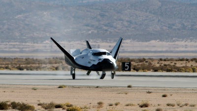 This Nov. 11, 2017 photo provided by Sierra Nevada Corporation shows the Dream Chaser spacecraft landing after a test flight at Edwards Air Force Base, Calif. The Sierra Nevada Corp. says its Dream Chaser had a successful free-flight drop test in the Mojave Desert on Saturday, Nov. 11, 2017.