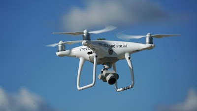 In this Oct. 16, 2017 photo, the Streetsboro police department's first drone flies in Streetsboro, Ohio,. Streetsboro Police purchased a drone this year and trained their first drone pilot officer in October, becoming one of hundreds of agencies across the country adopting the technology. They say they can't afford a helicopter, but a drone provides many of the same capabilities at a fraction of the price.