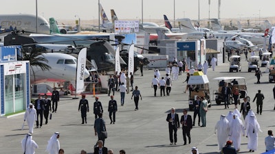 People visit an airshow in Dubai, United Arab Emirates, Wednesday, Nov. 15, 2017. Airbus signed a $49.5 billion deal on Wednesday to sell 430 airplanes to the Phoenix-based private equity firm that owns Frontier Airlines, striking the European aerospace company’s biggest deal ever at the Dubai Air Show.