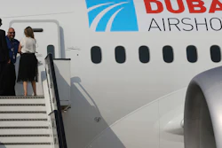 Emirati visitors walk past a Boeing 787-10 Dreamliner during the opening day of the Dubai Air Show, United Arab Emirates, Sunday, Nov. 12, 2017. The biennial Dubai Air Show opened Sunday with hometown long-haul carrier Emirates making a $15.1 billion buy of American-made Boeing 787-10 Dreamliners, as the world's biggest defense companies promoted their weapons amid heightened tensions between Saudi Arabia and Iran.