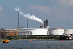 This Friday, Oct. 13, 2017, photo taken from upper Galveston Bay shows the Exxon Mobil Baytown refinery and chemical plant in Baytown, Texas. On Tuesday, Oct. 31, 2017, federal officials said that Exxon Mobil settled violations of the clean-air law with the Trump administration by agreeing to pay a $2.5 million civil penalty and spend $300 million on pollution-control technology at plants along the Gulf Coast. The plants are in Baytown, Beaumont and Mont Belvieu, Texas, and Baton Rouge, Louisiana. As part of the settlement, Exxon will spend $1 million to plant trees in Baytown.