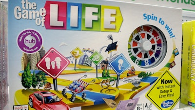 In this Nov. 11, 2015 file photo, the Hasbro board game 'The Game of Life' rests on a shelf in a toy store in North Attleboro, Mass. A trial begins Thursday, Nov. 16, 2017, in federal court in Los Angeles over who invented the game and who owns the rights to it.