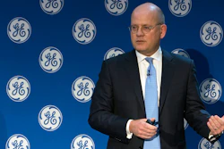 In this Monday, Nov. 13, 2017, photo provided by General Electric, GE Chairman and CEO John Flannery addresses investors at a meeting in New York. Flannery said the company is weighing the future of its transportation, industrial, and lighting businesses so that it can focus more intently on its most profitable divisions.