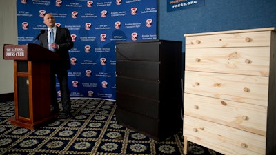In this Tuesday, June 28, 2016, file photo, with two Ikea dressers displayed at right, Consumer Product Safety Commission (CPSC) Chairman Elliot Kaye speaks during a news conference at the National Press Club in Washington. Ikea is relaunching a recall of 29 million chests and dressers after the death of a seventh child attributed to one of the dressers tipping over. Ikea CEO Lars Petersson said the company wants to increase awareness of the recall campaign, first announced in June 2016, for several types of chest and dressers that can easily tip over if not properly anchored to a wall.