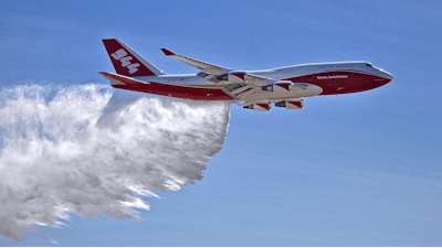 This May 5, 2016, file photo provided by Global Supertanker Services shows a Boeing 747 making a demonstration water drop at Colorado Springs Airport in Colorado Springs, Colo. The giant passenger jet converted to fight wildfires but grounded by U.S. officials during much of this year's fire season could be aloft much more next year. The U.S. Government Accountability Office on Thursday, Nov. 9, 2017, sided with Global SuperTanker Services in its protest against the U.S. Forest Service. The Colorado-based company challenged the Forest Service's 5,000-gallon (19,000-liter) limit on air tankers that kept the 19,000-gallon (72,000-liter) Boeing 747-400 idle until late August. After that it flew only in California.
