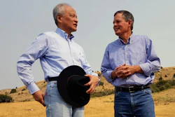 In this Sept. 8, 2017 photo, Chinese ambassador to the United States Cui Tiankai, left, speaks with Republican Montana Sen. Steve Daines about ways to expand the Chinese market for Montana beef. The two met with other Chinese and Montana agriculture officials during a tour of a ranch in the Bozeman area. China's largest online retailer has signed a deal with the Montana Stockgrowers Association to buy $200 million worth of Montana beef over the next three years and to build a $100 million slaughterhouse in the state.