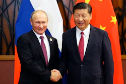 Russia's President Vladimir Putin, left, and Chinese President Xi Jinping shake hands during their meeting at the APEC Business Advisory Council dialogue in Danang, Vietnam Friday, Nov. 10, 2017.
