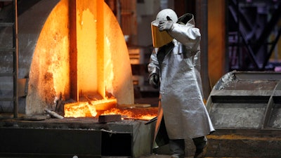 The Jan. 28, 2008 file picture shows a worker walking in the new furnace at the ThyssenKrupp steel factory in Duisburg, Germany. A new facility scheduled to open in April 2018 will cut down 10 million tons of CO2 emissions a year.