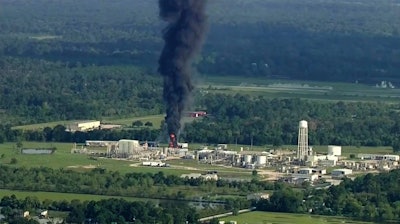 In this Sept. 1, 2017, file photo, smoke rises from the Arkema Inc. owned chemical plant in Crosby, near Houston, Texas. Federal investigators say they've seen no signs that the Houston-area plant that flooded and partially exploded during Hurricane Harvey considered moving its highly unstable compounds offsite as a precaution.