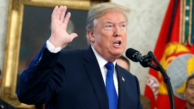 President Donald Trump speaks during an event to announce that Broadcom is moving its global headquarters to the United States, in the Oval Office of the White House, Thursday, Nov. 2, 2017, in Washington.