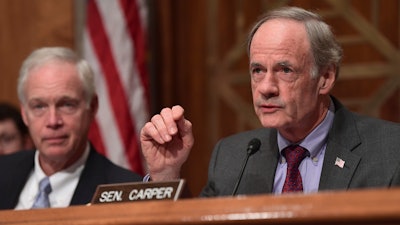 Sen. Thomas Carper, D-Del., right, sitting next to Senate Governmental Affairs Committee Chairman Sen. Ron Johnson, R-Wis., left, speaks on Capitol Hill in Washington, Tuesday, Oct. 31, 2017, during a hearing on the federal response to the 2017 hurricane season.