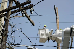 In this Oct. 19, 2017 file photo, a brigade from the Electric Power Authority repairs distribution lines damaged by Hurricane Maria in the Cantera community of San Juan, Puerto Rico. Puerto Rico's government scored a big win in court Monday, Nov. 13, 2017 after a judge rejected the appointment of a former military officer to oversee the U.S. territory's troubled power company.