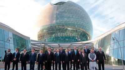 In this June 9, 2017, file photo, world leaders, including Russian President Vladimir Putin, center, pose for a photo with others as they attend the opening ceremony of the Astana Expo 2017 exhibition in Astana, Kazakstan. Minnesota is hoping to host the first World’s Fair on U.S. soil in nearly 40 years, but it will have to overcome bids by Poland’s third-largest city, Lodz, and the Argentine capital of Buenos Aires when a winner is selected Wednesday, Nov. 15, 2017, in Paris.