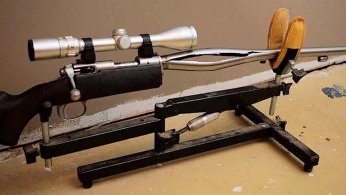 In this 2009 photo provided by Trent Procter, a Savage Arms stainless steel 10ML-II muzzleloader owned by Procter of Swan River, Manitoba, Canada, is displayed weeks after its barrel exploded and severely injured his left hand. Savage Arms recently agreed to pay a confidential settlement to Procter to resolve his lawsuit, one of several that allege the company kept a defective firearm on the market.
