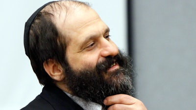 In this June 7, 2010, file photo former Agriprocessors executive Sholom Rubashkin appears at the Black Hawk County Courthouse in Waterloo, Iowa. President Donald Trump on Dec. 20, 2017, commuted the prison sentence of Rubashkin, a Iowa kosher meatpacking executive sentenced to 27 years in prison for money laundering — the first time he's used the presidential power. The decision to intervene on behalf of Rubashkin, who ran the Iowa headquarters of a family business that was the country's largest kosher meat-processing company, came at the urging of multiple members of Congress and other high-ranking officials who argued Rubashkin's sentence was too harsh, the White House said.
