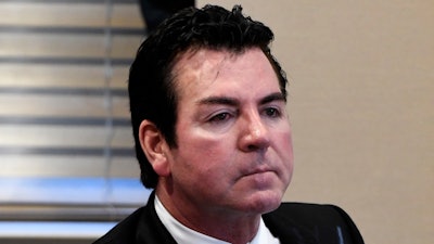 In this Wednesday, Oct. 18, 2017, file photo, Papa John’s founder and CEO John Schnatter attends a meeting in Louisville, Ky. Schnatter, who appears on the chain’s commercials and pizza boxes, will leave the CEO role in January 2018, weeks after he publicly criticized NFL leadership for the ongoing national anthem protests by football players. He will be replaced by Chief Operating Officer Steve Ritchie on Jan. 1. Schnatter, who is the company’s biggest shareholder, will stay on as chairman.