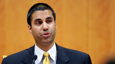 In this Friday, Aug. 9, 2013, file photo, Federal Communications Commission Commissioner Ajit Pai speaks during an FCC meeting in Washington. The FCC is voting Thursday, Dec. 14 to undo Obama-era “net neutrality” rules that guaranteed equal access to the internet. The industry promises that the internet experience isn’t going to change, but the issue has struck a nerve. Protests have erupted online and in the streets as everyday Americans worry that companies like Comcast, Verizon and AT&T will be able to control what they see and do online.