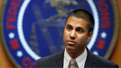 Federal Communications Commission (FCC) Chairman Ajit Pai arrives for an FCC meeting where they will vote on net neutrality, Thursday, Dec. 14, 2017, in Washington.