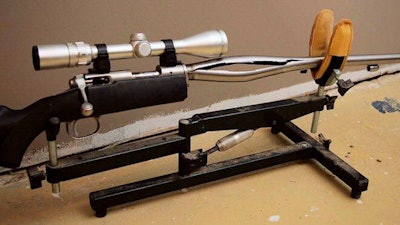 In this 2009 photo provided by Trent Procter, a Savage Arms stainless steel 10ML-II muzzleloader owned by Procter of Swan River, Manitoba, Canada, is displayed weeks after its barrel exploded and severely injured his left hand. Savage Arms recently agreed to pay a confidential settlement to Procter to resolve his lawsuit, one of several that allege the company kept a defective firearm on the market.