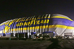 This photo provided by the Goodyear Tire & Rubber Co. shows the nearly-complete inflation of a giant inflatable hangar that will be the permanent home of one of the company's new semi-rigid airships, Wednesday, Dec. 13, 2017 in Carson, Calif. The building standing nine stories tall and stretching the length of a football field went up early Wednesday along Interstate 405 south of Los Angeles.