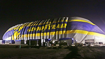 This photo provided by the Goodyear Tire & Rubber Co. shows the nearly-complete inflation of a giant inflatable hangar that will be the permanent home of one of the company's new semi-rigid airships, Wednesday, Dec. 13, 2017 in Carson, Calif. The building standing nine stories tall and stretching the length of a football field went up early Wednesday along Interstate 405 south of Los Angeles.