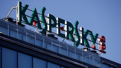 This Monday, Jan. 30, 2017, file photo shows a sign above the headquarters of Kaspersky Lab in Moscow. Britain's cybersecurity agency has told government departments not to use antivirus software from Moscow-based firm Kaspersky Lab, it was reported Saturday, Dec. 2, 2017.