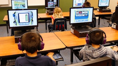 Are computers in the classroom more helpful to students – or the companies that sell the machines?